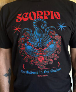 Colorful Zodiac shirt featuring bold vibrant color tones with the phrase Revelations in the shadows Hells inside on a cotton Poly blend tea