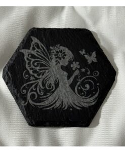 Black slate coasters featuring a delicate young fairies surrounded by flowers, one smelling blooms and one dancing with wings spread